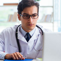 Doctor using a laptop computer